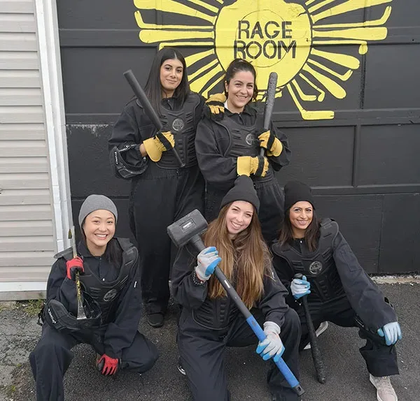 Photo of Girl group with Rage room Halifax weapons and protective gear